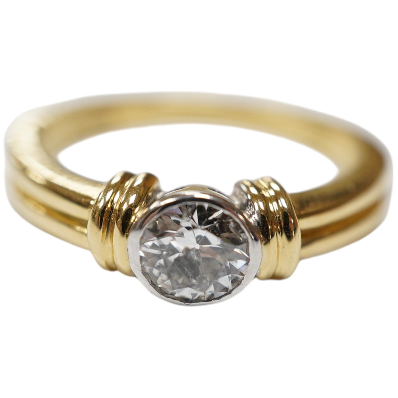 A modern 18ct gold and collet set solitaire diamond ring, size O, gross weight 5.7 grams. Condition - fair to good.